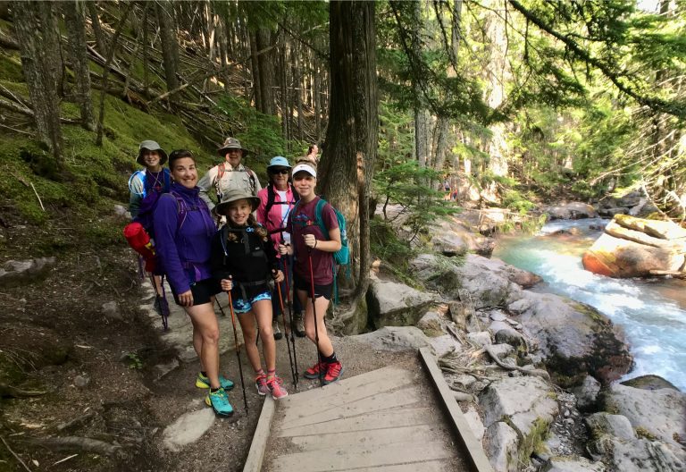A family hiking on the Avalanche Lake Trail in Glacier National Park